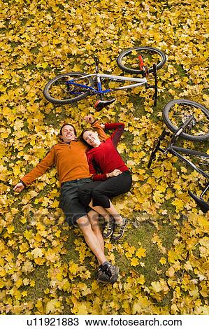 USA, Montana, Kalispell, Happy couple embracing in autumn View Large Photo Image Stock Image - USA, Montana, Kalispell, Happy couple embracing in autumn. Fotosearch
