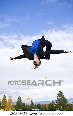 USA, Montana, Whitefish, businessman mid-air View Large Photo Image Stock Photograph - USA, Montana, Whitefish, businessman mid-air. Fotosearch