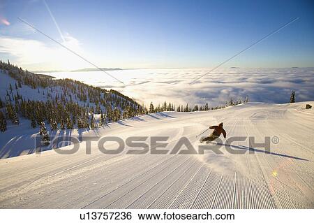 USA, Montana, Whitefish, Male skier on mountain slope at sunrise View Large Photo Image Stock Photograph - USA, Montana, Whitefish, Male skier on mountain slope at sunrise. Fotosearch