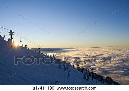 USA, Montana, Whitefish, Ski lift on mountain over clouds View Large Photo Image Stock Photograph - USA, Montana, Whitefish, Ski lift on mountain over clouds. Fotosearch