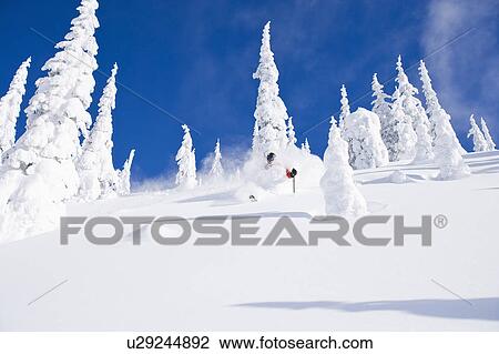 Stock Image - USA, Montana, Whitefish, skier on slope. Fotosearch