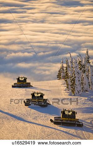 Stock Photo - USA, Montana, Whitefish, Snowmobile on ski slope. Fotosearch