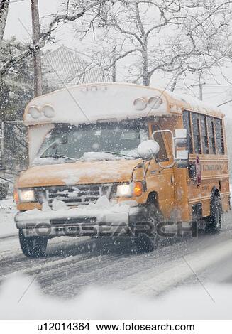 USA, New Jersey, Jersey City, school bus on road during blizzard View Large Photo Image Picture - USA, New Jersey, Jersey City, school bus on road during blizzard. Fotosearch