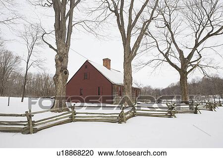 Stock Image - USA, New Jersey, Morristown, Morristown National Historical Park, Jockey Hollow, Tempe Wick House in winter. Fotosearch