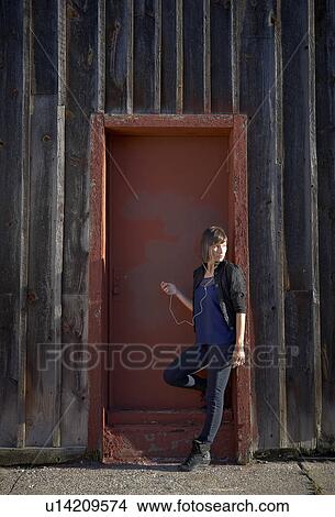 Picture - USA, New York City, Brooklyn, woman listening to mp3 player. Fotosearch