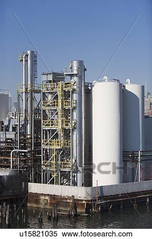 Stock Photography - USA, New York City, Oil storage tanks in refinery. Fotosearch