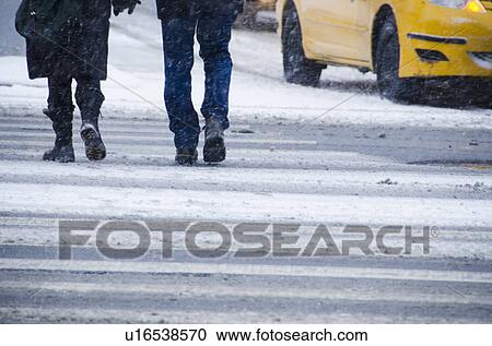 USA, New York City, Pedestrians crossing road in blizzard View Large Photo Image Stock Image - USA, New York City, Pedestrians crossing road in blizzard. Fotosearch