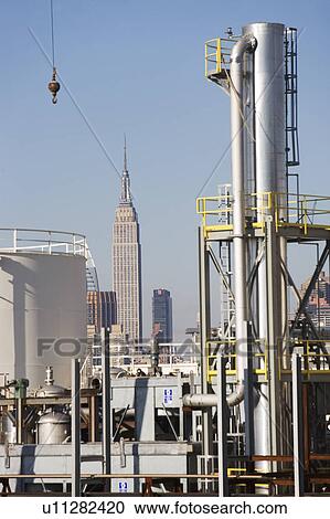 USA, New York City, Refinery installations with Empire State Building in background View Large Photo Image Stock Image - USA, New York City, Refinery installations with Empire State Building in background. Fotosearch