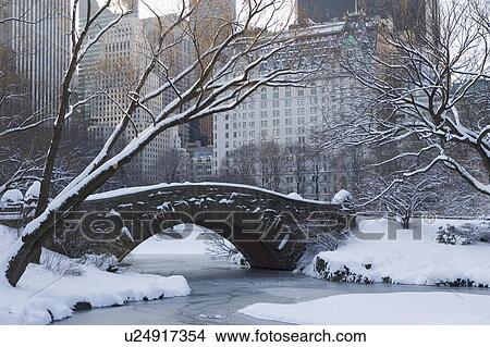 USA, New York City, View of Central Park in winter with Manhattan skyline in background View Large Photo Image Picture - USA, New York City, View of Central Park in winter with Manhattan skyline in background. Fotosearch