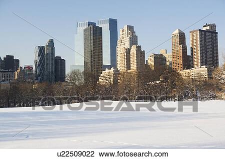 USA, New York City, View of Central Park in winter with Manhattan skyline in background View Large Photo Image Stock Image - USA, New York City, View of Central Park in winter with Manhattan skyline in background. Fotosearch