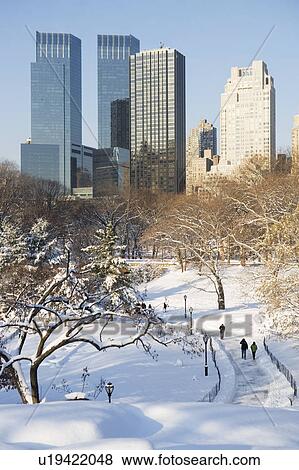 USA, New York City, View of Central Park in winter with Manhattan skyline in background View Large Photo Image Stock Photo - USA, New York City, View of Central Park in winter with Manhattan skyline in background. Fotosearch