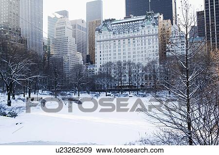 USA, New York City, View of Central Park in winter with Manhattan skyline in background View Large Photo Image Stock Photo - USA, New York City, View of Central Park in winter with Manhattan skyline in background. Fotosearch