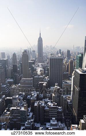 USA, New York City, View of Manhattan covered with snow, with Empire State Building in background View Large Photo Image Stock Photography - USA, New York City, View of Manhattan covered with snow, with Empire State Building in background. Fotosearch