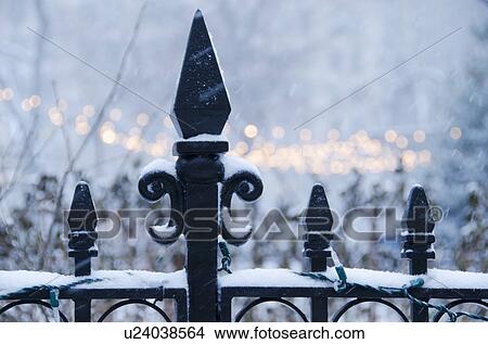 Picture - USA, New York State, New York City, antique fence covered with snow. Fotosearch