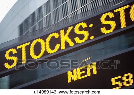 Stock Image - USA, New York State, New York City, Times Square, Stock Quotron, close-up. Fotosearch
