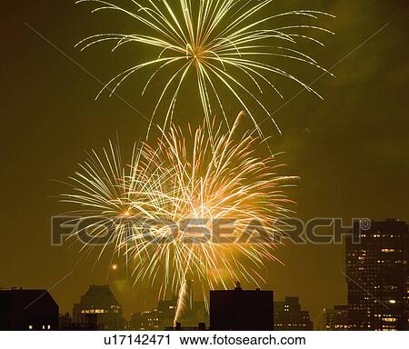Stock Image - USA, New York State, New York City, Skyline with fireworks display. Fotosearch