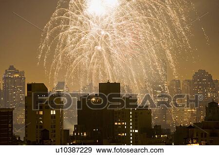 Stock Photo - USA, New York State, New York City, Skyline with fireworks display. Fotosearch