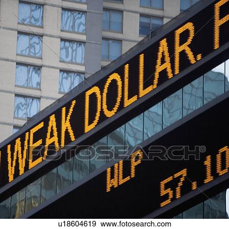 Stock Photo - USA, New York State, New York City, Times Square, Stock Quotron, close-up. Fotosearch
