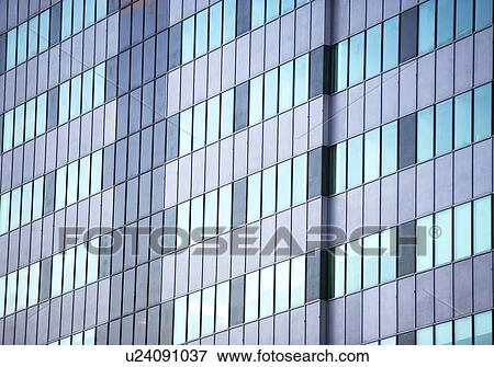 Stock Photo - USA, New York State, New York City, Glass wall of skyscraper. Fotosearch