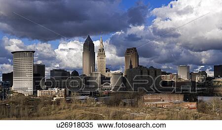 Stock Photography - USA, Ohio, Cleveland, cityscape with cloudy sky. Fotosearch