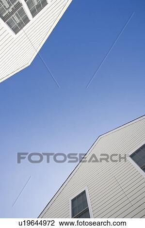 Stock Image - USA, Pennsylvania, clapboard houses and clear sky. Fotosearch