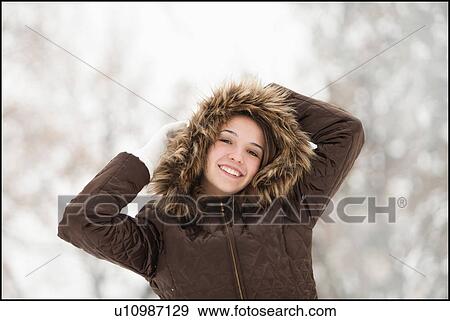 USA, Utah, Lehi, Portrait of young woman wearing winter coat outdoors View Large Photo Image Stock Photo - USA, Utah, Lehi, Portrait of young woman wearing winter coat outdoors. Fotosearch