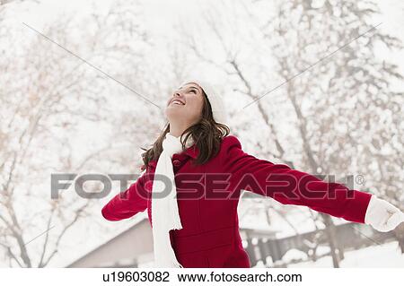 USA, Utah, Lehi, Young woman standing in snow View Large Photo Image Stock Image - USA, Utah, Lehi, Young woman standing in snow. Fotosearch