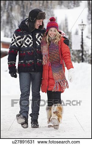USA, Utah, Salt Lake City, couple walking in snowy village View Large Photo Image Stock Image - USA, Utah, Salt Lake City, couple walking in snowy village. Fotosearch