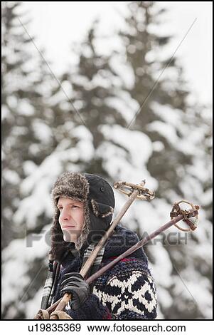 USA, Utah, Salt Lake City, man carrying ski poles View Large Photo Image Stock Photo - USA, Utah, Salt Lake City, man carrying ski poles. Fotosearch