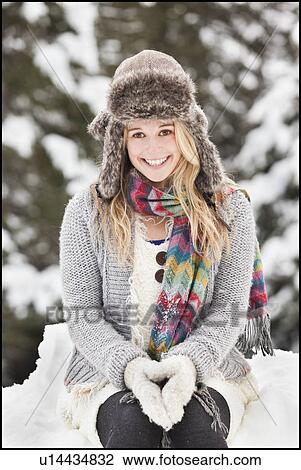 Stock Image - USA, Utah, Salt Lake City, portrait of young woman in winter clothing. Fotosearch