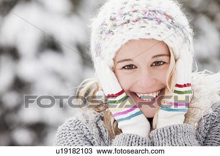 USA, Utah, Salt Lake City, portrait of young woman in winter clothing View Large Photo Image Stock Image - USA, Utah, Salt Lake City, portrait of young woman in winter clothing. Fotosearch