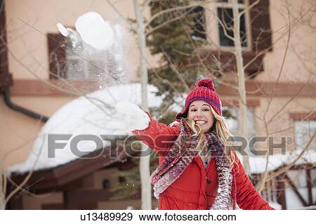 USA, Utah, Salt Lake City, Portrait of young woman throwing snowball View Large Photo Image Stock Photo - USA, Utah, Salt Lake City, Portrait of young woman throwing snowball. Fotosearch