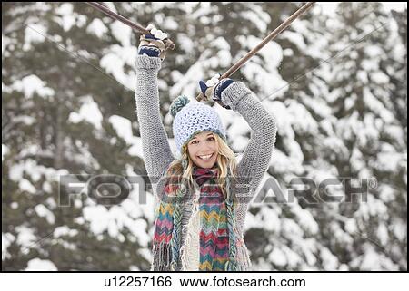 Stock Photograph - USA, Utah, Salt Lake City, portrait of young woman in winter clothing. Fotosearch