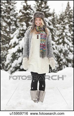 Stock Photograph - USA, Utah, Salt Lake City, portrait of young woman in winter clothing. Fotosearch