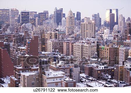 Stock Image - USA, View of New York City covered with snow . Fotosearch