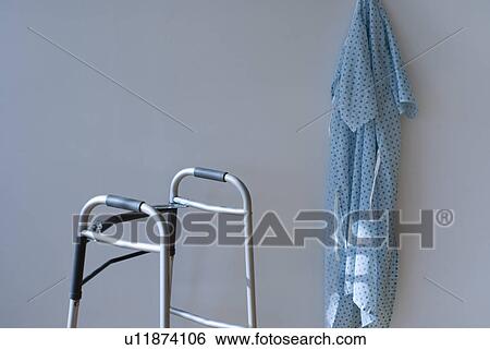 Stock Photograph - Walking frame and patients gown in hospital. Fotosearch