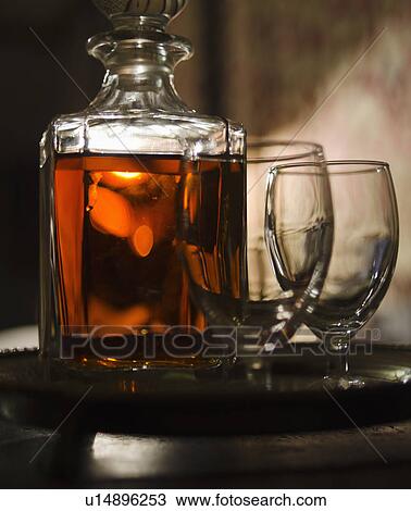 Whiskey in decanter with glasses View Large Photo Image Stock Image - Whiskey in decanter with glasses. Fotosearch