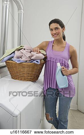 Woman doing laundry View Large Photo Image Stock Photo - Woman doing laundry. Fotosearch