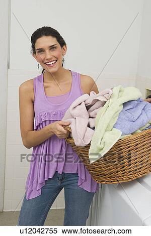 Stock Photography - Woman doing laundry. Fotosearch