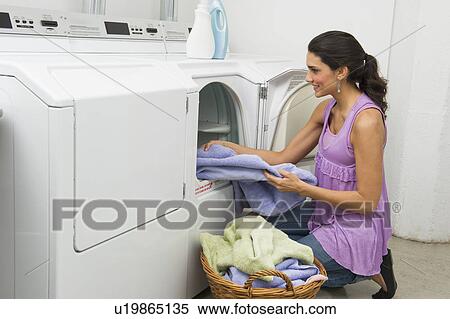 Woman doing laundry View Large Photo Image Stock Photography - Woman doing laundry. Fotosearch
