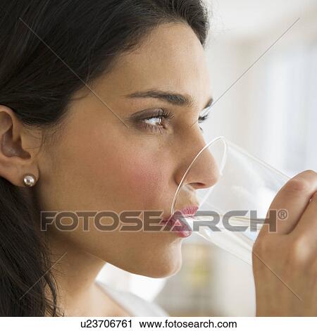 Woman drinking water View Large Photo Image Stock Image - Woman drinking water. Fotosearch