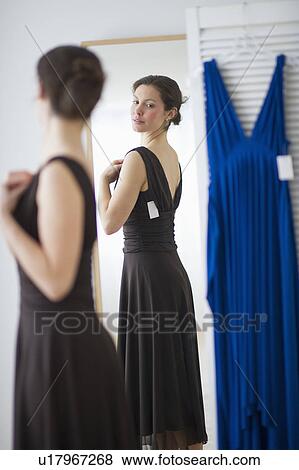 Woman fitting new dress View Large Photo Image Stock Photo - Woman fitting new dress. Fotosearch