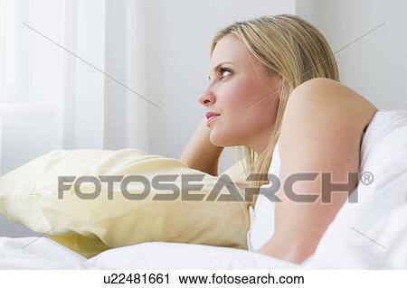 Woman in bed View Large Photo Image Stock Image - Woman in bed. Fotosearch