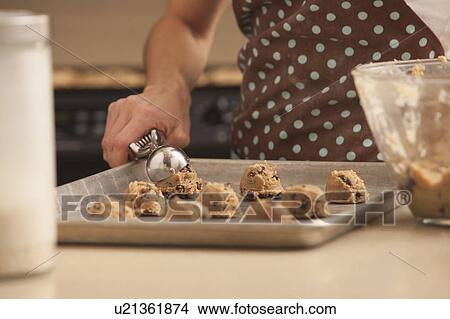 Woman preparing chocolate cookies View Large Photo Image Picture - Woman preparing chocolate cookies. Fotosearch