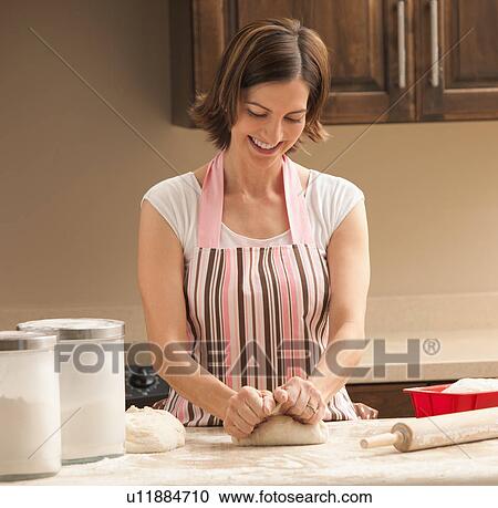 Woman preparing dough View Large Photo Image Stock Image - Woman preparing dough. Fotosearch