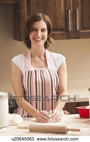 Woman preparing dough View Large Photo Image Stock Image - Woman preparing dough. Fotosearch