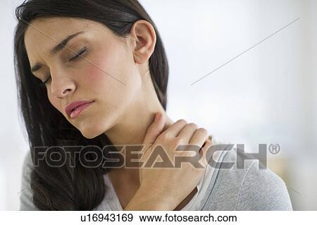 Woman suffering from neck pain View Large Photo Image Stock Photo - Woman suffering from neck pain. Fotosearch