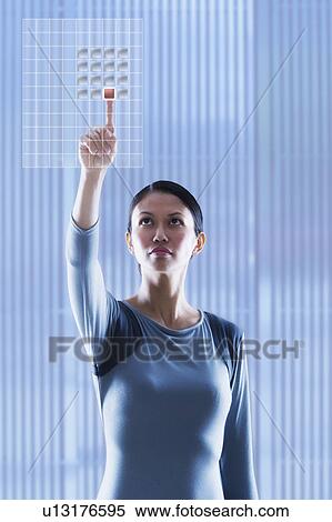 Woman touching glass panel View Large Photo Image Stock Photography - Woman touching glass panel. Fotosearch