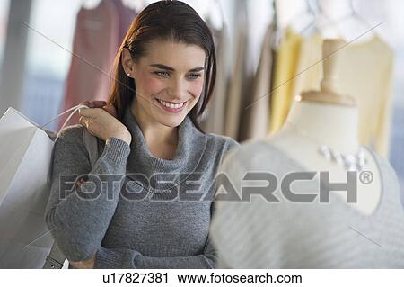 Young attractive woman shopping View Large Photo Image Stock Image - Young attractive woman shopping. Fotosearch