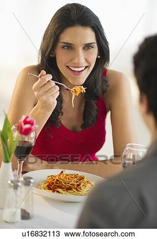 Young couple eating dinner View Large Photo Image Stock Image - Young couple eating dinner. Fotosearch